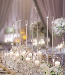 Long Arrangement of Glass and Candles
Photography: The Observatory
Read More:
http://www.insideweddings.com/weddings/classic-ballroom-wedding-with-mixed-metal-motif-in-washington-dc/957/ long arrangement glass candles floral runner shimmering linen greenery classic wedding reception