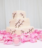 Cherry Blossom Cake
Photography: Ray J. Gadd of Steve Smith Wedding Photography
Read More:
http://www.insideweddings.com/weddings/sophisticated-pink-celebration-in-sun-valley-idaho/462/ Wedding cake on pink rose petals with cherry blossom design
