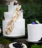 Nature-Inspired Cakes
Photography: Lucky Love Photography
Read More:
http://www.insideweddings.com/weddings/rustic-inspirational-wedding-shoot-in-a-forest-with-woodsy-details/661/ White wedding cake with golden leaves, and white wedding cake with wood grain etchings, flowers