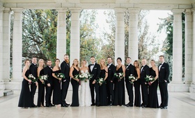 Elegant Wedding Party in Black Attire
Photography: Carrie King Photography
Read More:
http://www.insideweddings.com/weddings/chic-winter-wedding-at-a-church-industrial-artsy-venue-in-denver/1289/ bride in berta wedding dress groom with bridesmaids in black evening gowns groomsmen in tuxedos