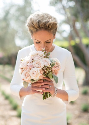 Bride In Three Quarter Sleeve Wedding Dress Smells Rose Bouquet Bride In Three Quarter Sleeve Wedding Dress Smells Rose Bouquet