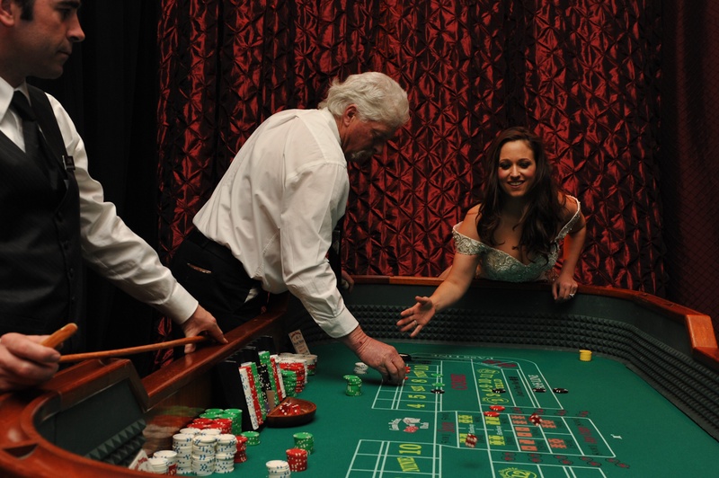 Casino Games
Photography: Handeland Tesoro Photography
Read More:
http://www.insideweddings.com/weddings/snowy-outdoor-winter-ceremony-cozy-lodge-reception/522/ Bride playing craps at wedding reception