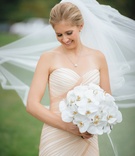 Bride Holding Bouquet with Veil Blowing
Photography: Jess + Nate Studios
Read More:
http://www.insideweddings.com/weddings/museum-wedding-with-gorgeous-rooftop-ceremony-in-washington-dc/1101/ Bride in strapless mark zunino blush mermaid gown holding bouquet white orchids veil blowing in wind