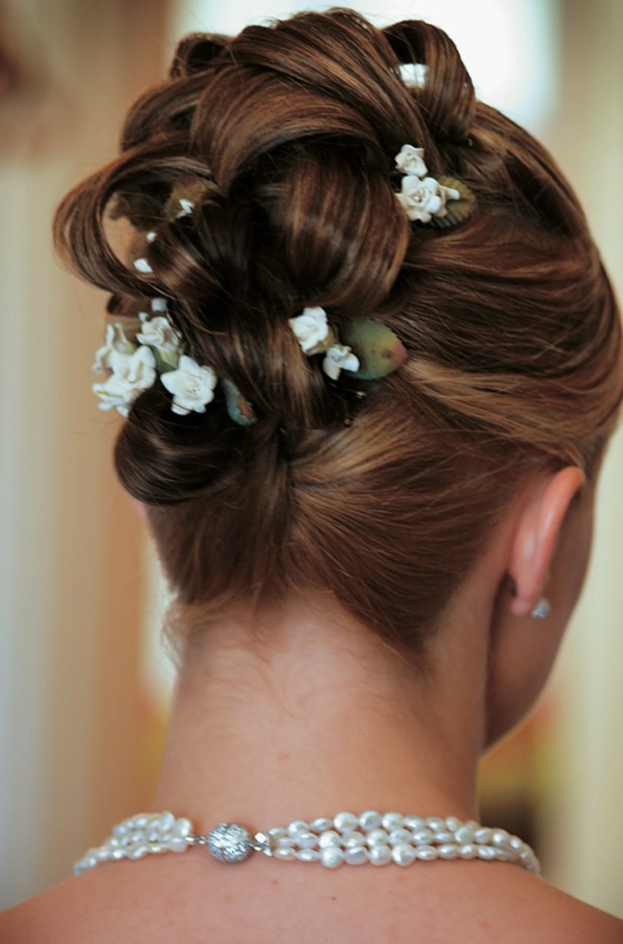 Updo Hairstyle With Flowers
Photography: Mermin + Christie Photographers
Read More:
http://www.insideweddings.com/weddings/tropical-theme-beach-wedding-in-naples-florida/184/ Braided updo hairstyle studded with tiny flowers