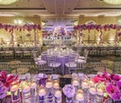 Purple Flower Arrangements in Ballroom