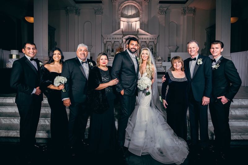 Couple with Families at Altar
Photography: Jimmy Bui Photography
Read More:
http://www.insideweddings.com/weddings/elegant-edgy-wedding-inspired-by-disney-at-vibiana-in-downtown-la/1229/ wedding portrait bride and groom with families in front of altar at vibiana winter wedding