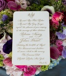 Gold Calligraphy Invitation
Photography: Fred Marcus Studio
Read More:
http://www.insideweddings.com/weddings/pink-purple-garden-inspired-tented-wedding-in-new-york/624/ White wedding invitation with gold calligraphy in a bed of colorful flowers