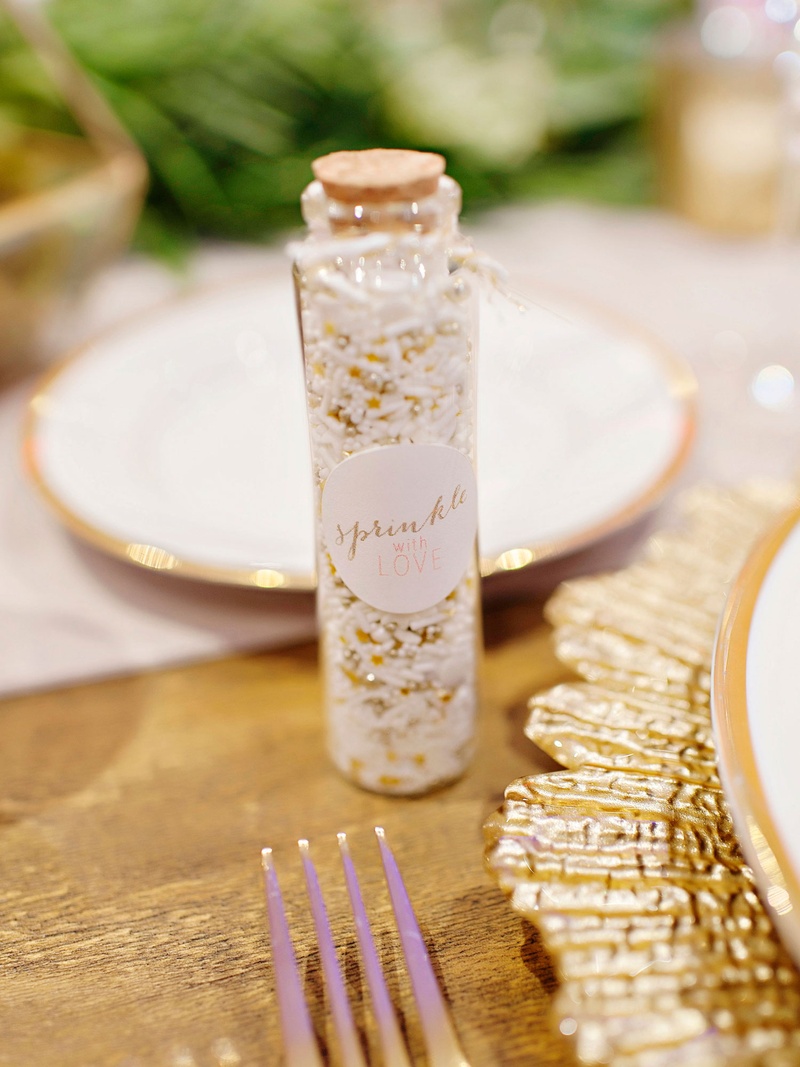 Sprinkles at Place Settings
Photography: Kortnee Kate Photography
Read More:
http://www.insideweddings.com/weddings/hometown-celebration-with-rustic-details-colorful-pastel-flowers/1035/ Wedding reception favors sprinkles in glass bottle with cork to throw at couple during grand exit