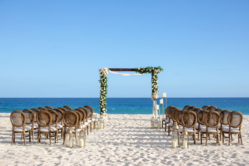 Cane Chairs at Beach Wedding Ceremony
Photography: Collin Pierson Photography
Read More:
http://www.insideweddings.com/weddings/beach-wedding-ceremony-romantic-reception-inspiration-in-cabo/1304/ wedding ceremony on sand beach modern arch greenery pink flower gold lantern cane round chair back