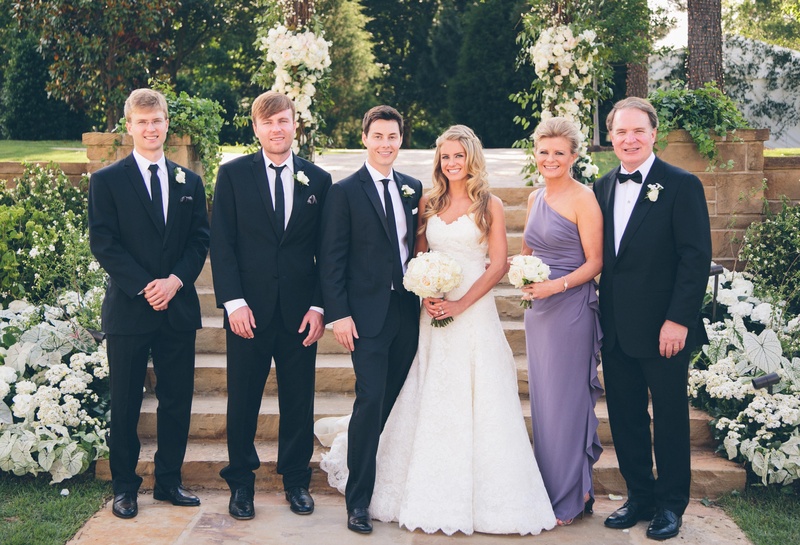 The Bride's Family
Photography: David %26 Tammy Molnar
Read More:
http://www.insideweddings.com/weddings/an-exquisite-backyard-wedding-in-tennessee/532/ Young newlyweds pose with brothers and mother-of-the-bride
