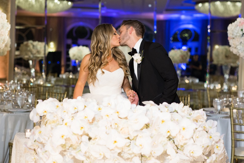 Newlyweds Kiss at Sweetheart Table
Photography: Duke Photography
Read More:
http://www.insideweddings.com/weddings/jewish-ceremony-classic-ballroom-reception-in-beverly-hills/922/ sweetheart table with large display of white orchids
