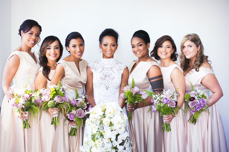 Bridesmaids with Lavender Bouquets
Photography: Callaway Gable
Read More:
http://www.insideweddings.com/weddings/modern-in-the-round-ceremony-whimsical-garden-inspired-reception/1155/ Bride in high neck lace wedding dress bridesmaids in champagne pink v neck bateau dresses purple