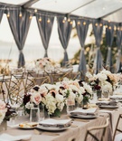 Low Centerpieces at Clear Tent Reception
Photography: Sam %26 Sola Lee Photography
Read More:
http://www.insideweddings.com/weddings/modern-outdoor-ceremony-tent-reception-in-seattle-on-puget-sound/1309/ wedding reception neutral linens low centerpiece white blush burgundy grey drapes string lights