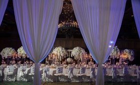 Fire %26 Ice Reception Inspiration
Photography: Collin Pierson Photography
Read More:
http://www.insideweddings.com/weddings/winter-wedding-inspirational-shoot-with-opulent-frosted-decor/1108/ Wedding inspiration long table white flower centerpiece drapery drapes purple violet lighting