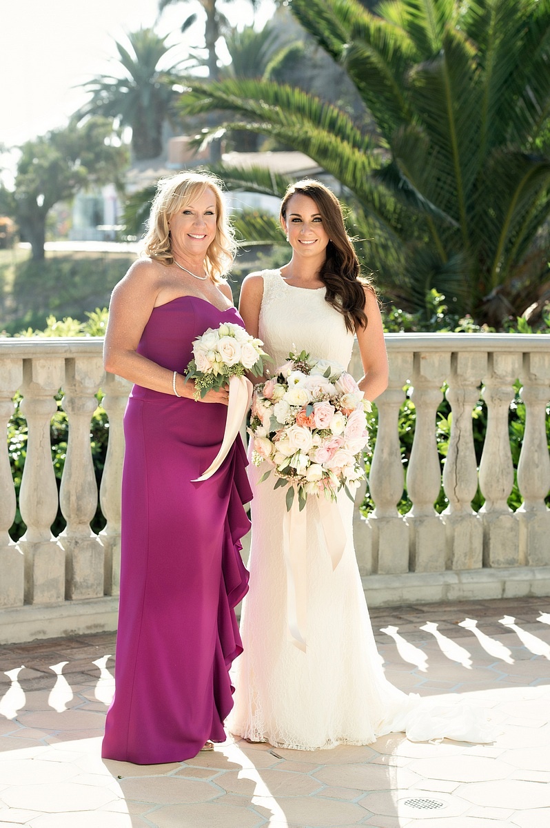 Bride and Mother in Fuchsia with Bouquets
Photography: Laurie Bailey Photography
Read More:
http://www.insideweddings.com/weddings/oceanfront-wedding-ceremony-classic-romantic-ballroom-reception/854/ bride white sheath dress mother fuchsia pink purple dress bouquets balcony