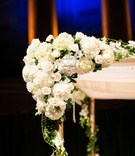 Fresh Flowers on Chuppah Corner
Photography: Images by Berit, Inc.
Read More:
http://www.insideweddings.com/weddings/gatsby-inspired-jewish-wedding-with-purple-gold-decor-in-new-york/720/ Corner of chuppah decorated with white rose, hydrangea, and orchid flowers with ivy