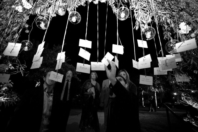 Floral Arch Escort Card Display
Photography: Simone %26 Martin Photography
Read More:
http://www.insideweddings.com/weddings/sophisticated-autumn-inspired-wedding-in-napa-valley-california/262/ Black and white photo of seating card tree display