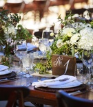 Wood Block Table Number
Photography: Mischa Photography
Read More:
http://www.insideweddings.com/weddings/heartwarming-ranch-wedding-with-sophisticated-rustic-details/673/ Rustic outdoor wedding reception table with wood block table number, white roses, hydrangeas