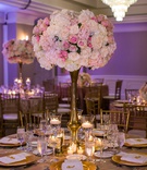 Centerpiece Backed by Purple Lighting
Photography: Embrace Life Photography
Read More:
http://www.insideweddings.com/weddings/rooftop-ceremony-ballroom-reception-where-the-couple-first-met/1257/ blush and ivory floral centerpiece on gold stand, purple uplighting ballroom reception