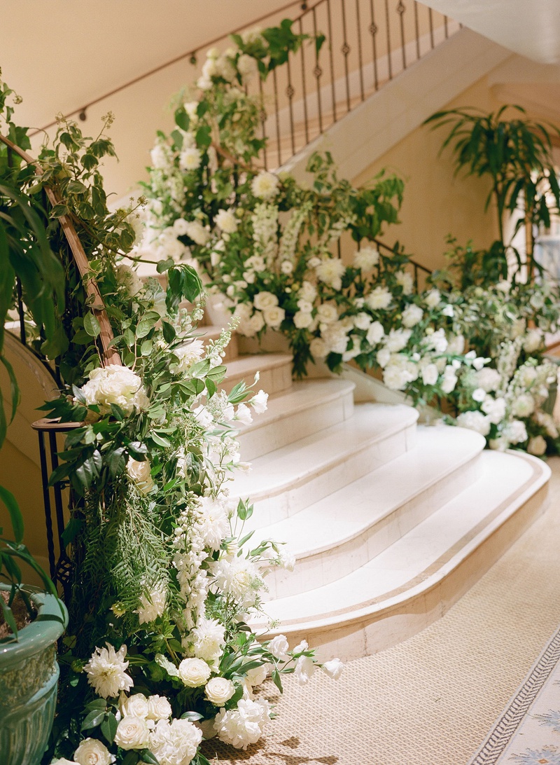 White Flowers %26 Greenery on Stairs
Photography: Michelle Beller Photography
Read More:
http://www.insideweddings.com/weddings/classic-ceremony-beachfront-ballroom-reception-in-santa-monica/1234/ stairs to wedding reception ballroom decorated with fresh greenery and white flowers dahlias roses