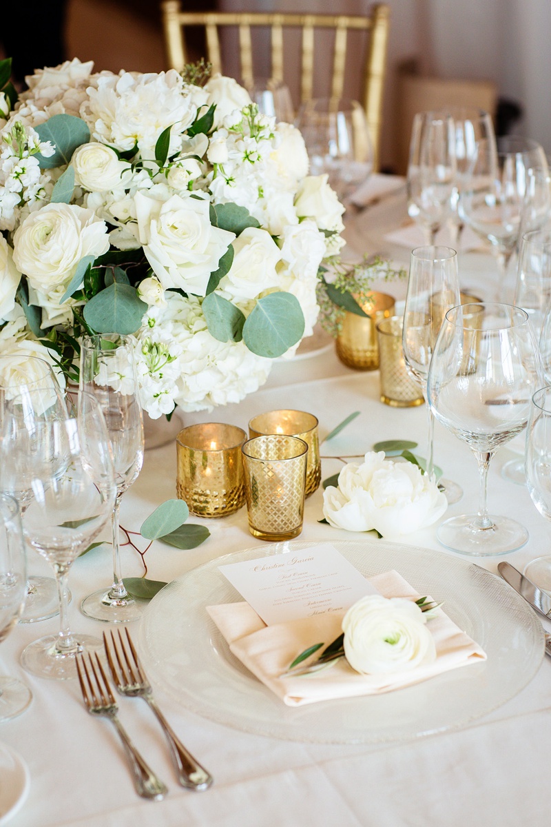 Trio of Gold Votives
Photography: Chard Photo
Read More:
http://www.insideweddings.com/weddings/alfresco-ceremony-on-the-coast-classic-ballroom-reception/1290/ white floral centerpiece, trio of gold votives, bloom on napkins,
