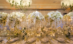 Floral Arrangements of Roses and Orchids
Photography: Carasco Photography
Read More:
http://www.insideweddings.com/weddings/parisian-inspired-styled-shoot-with-spring-florals/956/ tall and low floral arrangements with white roses and orchids