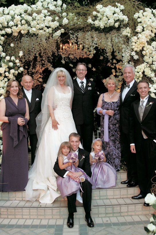 Bride and Groom With Family
Photography: Dalal Photography
Read More:
http://www.insideweddings.com/weddings/garden-themed-spiritual-wedding-on-the-autumnal-equinox/148/ Bride and groom stand with family in front a chuppah composed of branches and white flowers