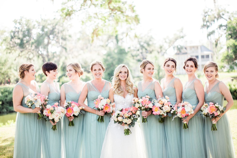 Bridesmaids with Mint-Hued Dresses
Photography: Vitor Lindo Photo + Video
Read More:
http://www.insideweddings.com/weddings/soft-romantic-spring-destination-wedding-in-south-carolina/1285/ bride with bridesmaids in mint blue green dresses sheer necklines coral peony bouquets updos