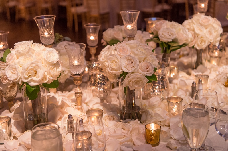 Head Table with Roses and Candles
Photography: Carasco Photography
Read More:
http://www.insideweddings.com/weddings/jewish-wedding-with-classic-ivory-and-gold-decor-in-chicago/983/ classic wedding with white roses and crystal candle holders, gold votives