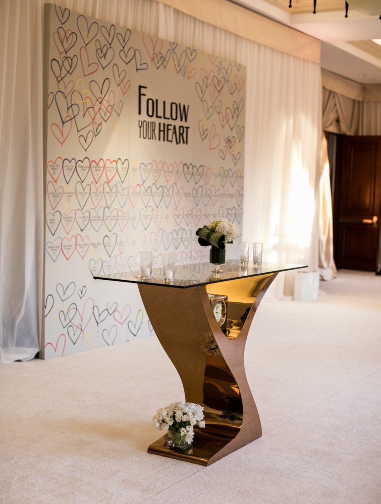 Gold Table in Front of Heart Backdrop
Photography: Samuel Lippke Studios
Read More:
http://www.insideweddings.com/weddings/outdoor-jewish-wedding-ceremony-luxe-reception-in-california/1160/ Wedding reception unique escort card ideas hearts colorful follow your heart
