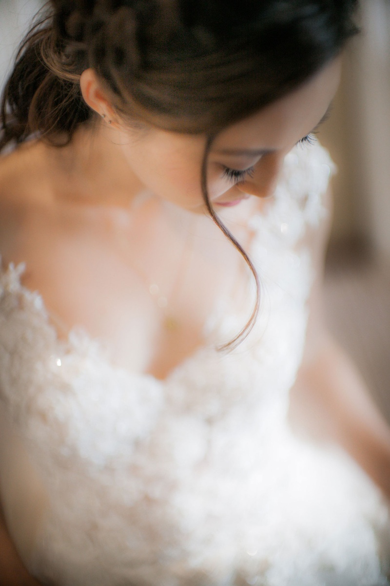 Bride with Low Ponytail Hairstyle
Photography: Clane Gessel Photography
Read More:
http://www.insideweddings.com/weddings/ocean-view-ceremony-with-cultural-traditions-elegant-reception/1291/ bride in elegant v neck lace wedding dress low pony tail curled wisp framing face