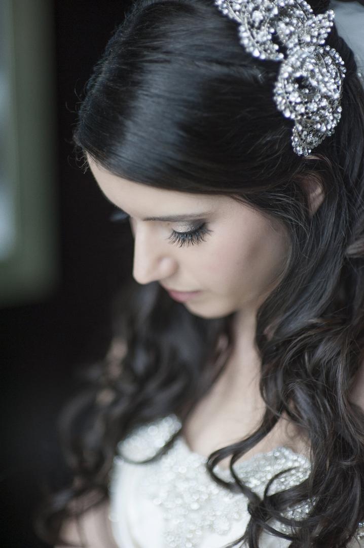Crystal Bridal Headpiece
Photography: Justin Marantz
Read More:
http://www.insideweddings.com/weddings/unforgettable-miami-wedding-with-acrobats-tiger-cubs-fireworks/437/ Bride with brown hair looks down with crystal headband