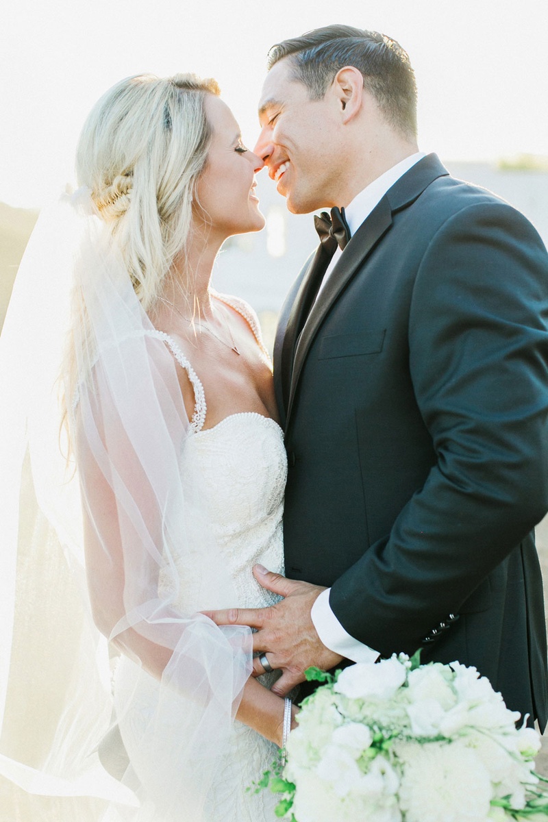 Bride and Groom About to Kiss
Photography: This Modern Romance
Read More:
http://www.insideweddings.com/weddings/rustic-chic-wedding-with-wooden-accents-and-verdant-details/861/ bride in galia lahav groom in men's wearhouse about to kiss long veil