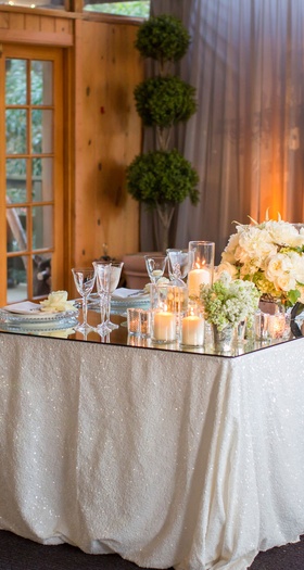 Sweetheart Table with Love Seat
Photography: KLK Photography
Read More:
http://www.insideweddings.com/weddings/nature-inspired-alfresco-ceremony-tent-reception-at-malibu-ranch/811/ mirrored sweetheart table with glittery white linens and a mirror table, tufted loveseat