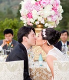 Bride %26 Groom Kiss at Reception
Photography: Thisbe Grace Photography
Read More:
http://www.insideweddings.com/weddings/outdoor-wedding-with-pink-gold-decor-at-a-vineyard-in-california/691/ Groom in Vera Wang in Black suit kisses bride in Vera Wang sleeveless gown, jeweled headband