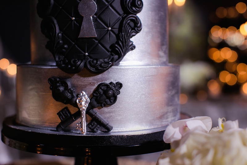 Black %26 Silver Key Details on Cake
Photography: Gold Grid Studios
Read More:
http://www.insideweddings.com/weddings/celebratory-wedding-shoot-with-elegant-romantic-decor-in-chicago/728/ Wedding cake in silver with black tufted details, keyhole, antique key embellishments