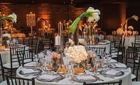 Calla Lily Tall Centerpiece at Reception
Photography: Carasco Photography
Read More:
http://www.insideweddings.com/weddings/classic-church-ceremony-reception-at-art-deco-venue-in-chicago/1294/ wedding reception brick wall round table calla lily flower centerpiece glass hurricane hydrangea
