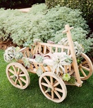 Wooden Wagon with Desert Plants
Photography: Traina Photography
Read More:
http://www.insideweddings.com/weddings/elegant-wedding-event-with-organic-influences-in-oklahoma-city/1021/ wagon for baby flower girl, wedding wagon with air plant and succulents