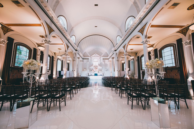 Black %26 White Ceremony at Vibiana
Photography: Jimmy Bui Photography
Read More:
http://www.insideweddings.com/weddings/elegant-edgy-wedding-inspired-by-disney-at-vibiana-in-downtown-la/1229/ vibiana wedding ceremony black chairs mirror riser candelabra white flowers