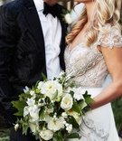 Bride %26 Groom Kiss with Bouquet
Photography: KingenSmith
Read More:
http://www.insideweddings.com/weddings/modern-romantic-wedding-with-glam-geometric-details-in-chicago/1171/ Bride in jewel cap sleeve wedding dress kissing groom bouquet white dahlia, ranunculus, garden rose