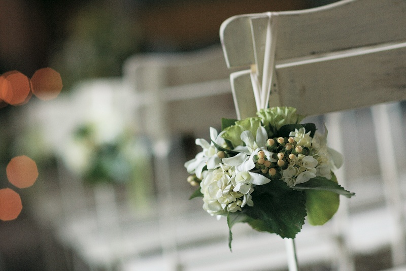 Ceremony Decor
Photography: Sherman Chu Photographer
Read More:
http://www.insideweddings.com/weddings/elegant-garden-style-vineyard-wedding-in-sonoma-california/205/ Wedding ceremony seats decorated with bundles of green and white flowers