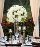 Candlesticks %26 Ivory Centerpieces
Photography: Paul Barnett Photography
Read More:
http://www.insideweddings.com/weddings/fall-wedding-with-outdoor-ceremony-tented-reception-in-california/1220/ wedding reception tall centerpiece white hydrangea roses greenery wood chairs candles