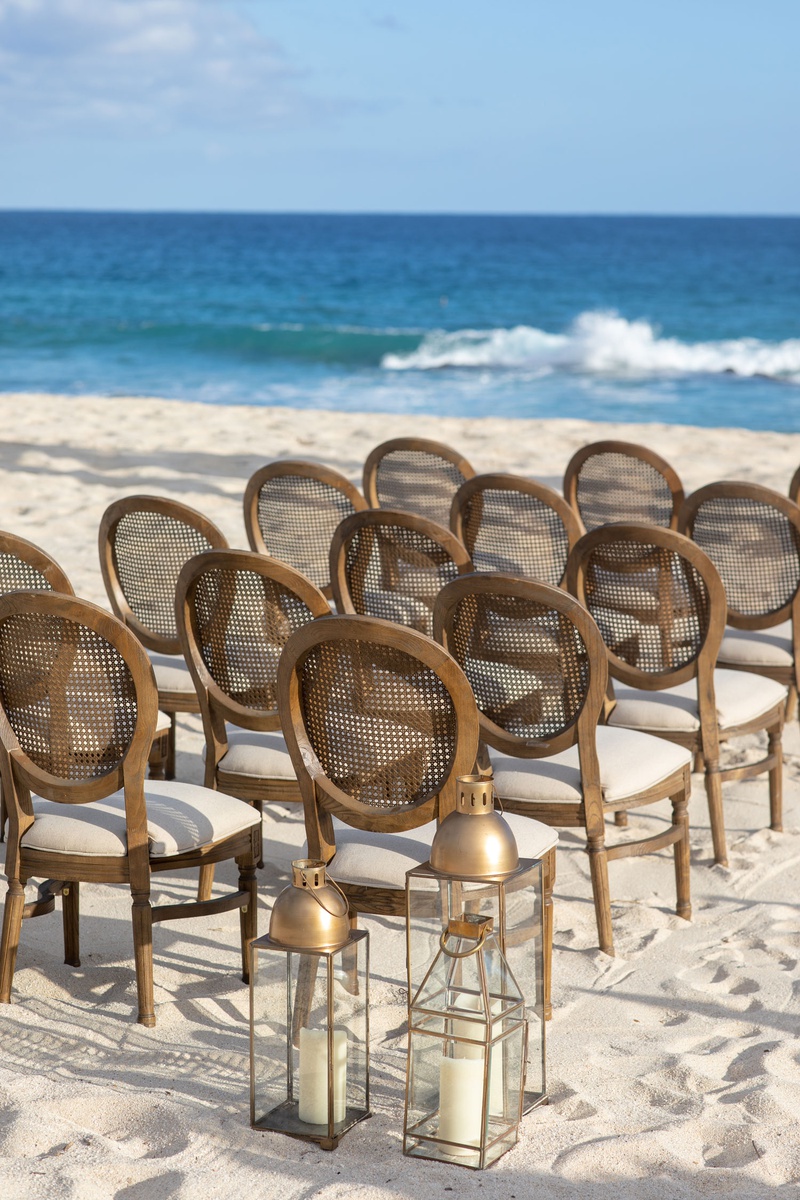 Lanterns %26 Cane Chairs on Beach
Photography: Collin Pierson Photography
Read More:
http://www.insideweddings.com/weddings/beach-wedding-ceremony-romantic-reception-inspiration-in-cabo/1304/ beach wedding ceremony decor round back wood cane chairs white cushions gold lantern white sand