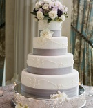 Elegant Wedding Cake
Photography: Images by Berit, Inc.
Read More:
http://www.insideweddings.com/weddings/east-coast-countryside-wedding-with-vintage-details/521/ White cake with ribbon band and fresh flowers on top