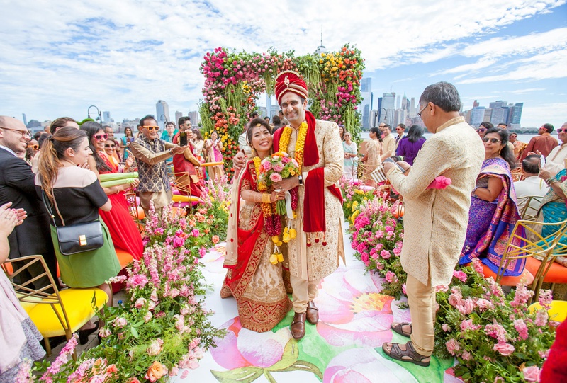 Colorful Wedding Ceremony Recessional
Photography: Clane Gessel Photography
Read More:
http://www.insideweddings.com/weddings/colorful-city-view-wedding-featuring-indian-and-japanese-traditions/1353/ indian american groom japanese bride multicultural wedding flower print aisle guests colored chairs