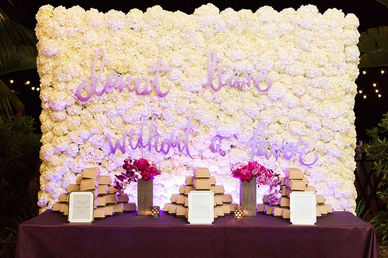 White Hydrangea Wall Behind Donut Display
Photography: Katie Stoops Photography
Read More:
http://www.insideweddings.com/weddings/bright-playful-oceanfront-wedding-with-delectable-four-course-menu/757/ white hydrangea wall with donut doughnut message purple text calligraphy purple table linens flowers