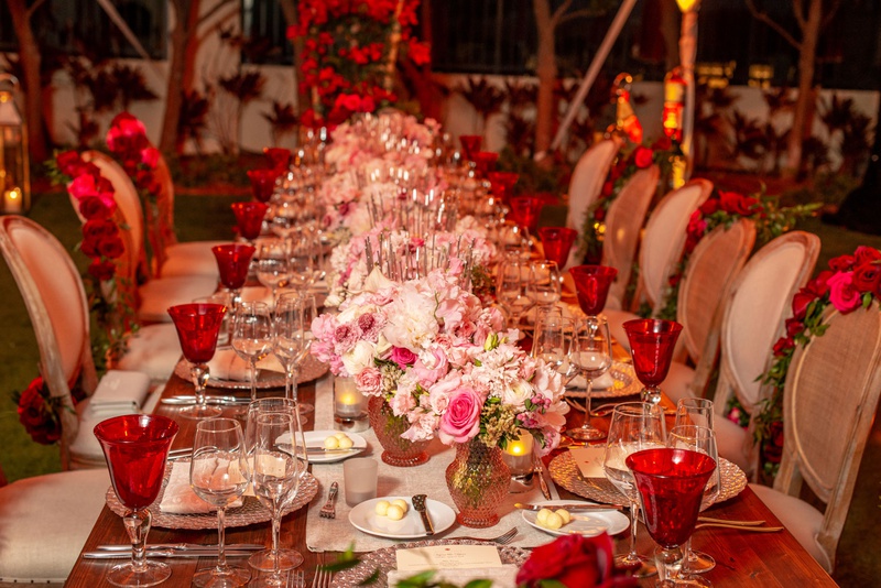 Wood Table with Low Pink Centerpieces
Photography: Suzanne Delawar Studios
Read More:
http://www.insideweddings.com/weddings/intimate-oceanfront-wedding-with-romantic-red-pink-white-palette/1235/ wedding reception long wood table pink flower centerpiece red goblets roses