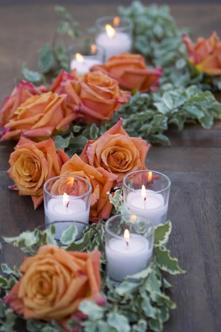 Low Orange Centerpiece
Photography: Simone %26 Martin Photography
Read More:
http://www.insideweddings.com/weddings/sophisticated-autumn-inspired-wedding-in-napa-valley-california/262/ Orange roses with greenery and small white candles