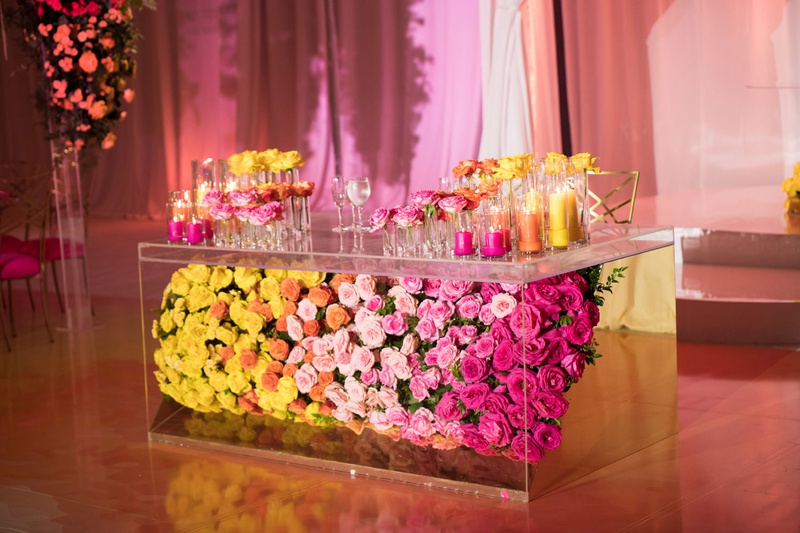 Lucite Sweetheart Table
Photography: Clane Gessel Photography
Read More:
http://www.insideweddings.com/weddings/colorful-city-view-wedding-featuring-indian-and-japanese-traditions/1353/ wedding reception yellow orange pink flowers in lucite table multicolored wedding reception decor