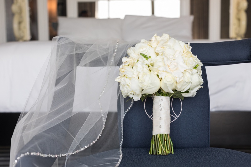 Veil with White Bouquet
Photography: Kristin Anderson
Read More:
http://www.insideweddings.com/weddings/classic-wedding-colors-with-modern-elements-in-santa-monica/1031/ traditional white flower bridal bouquet next to veil with crystal border